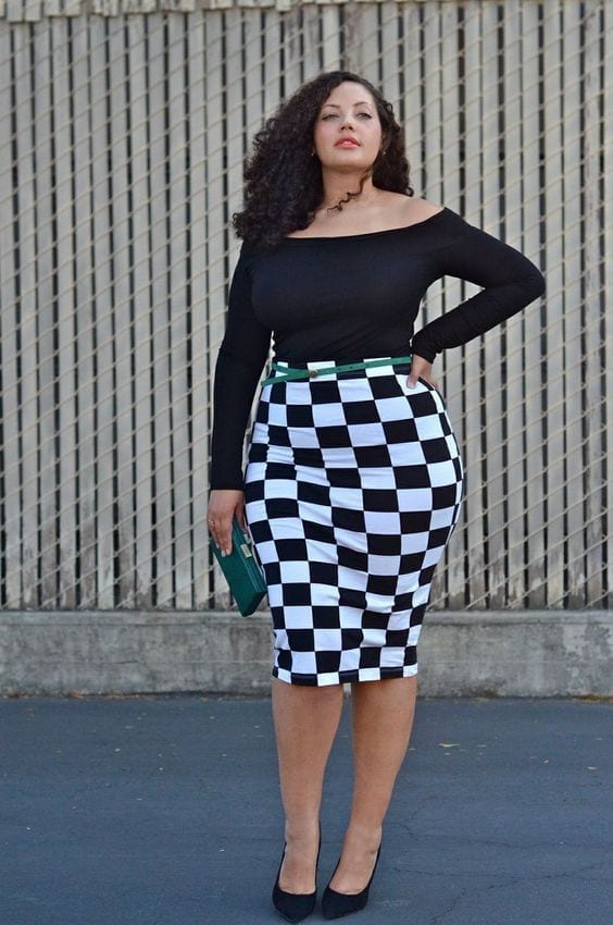 #9 - Check printed skirt outfit with a shiny black shirt